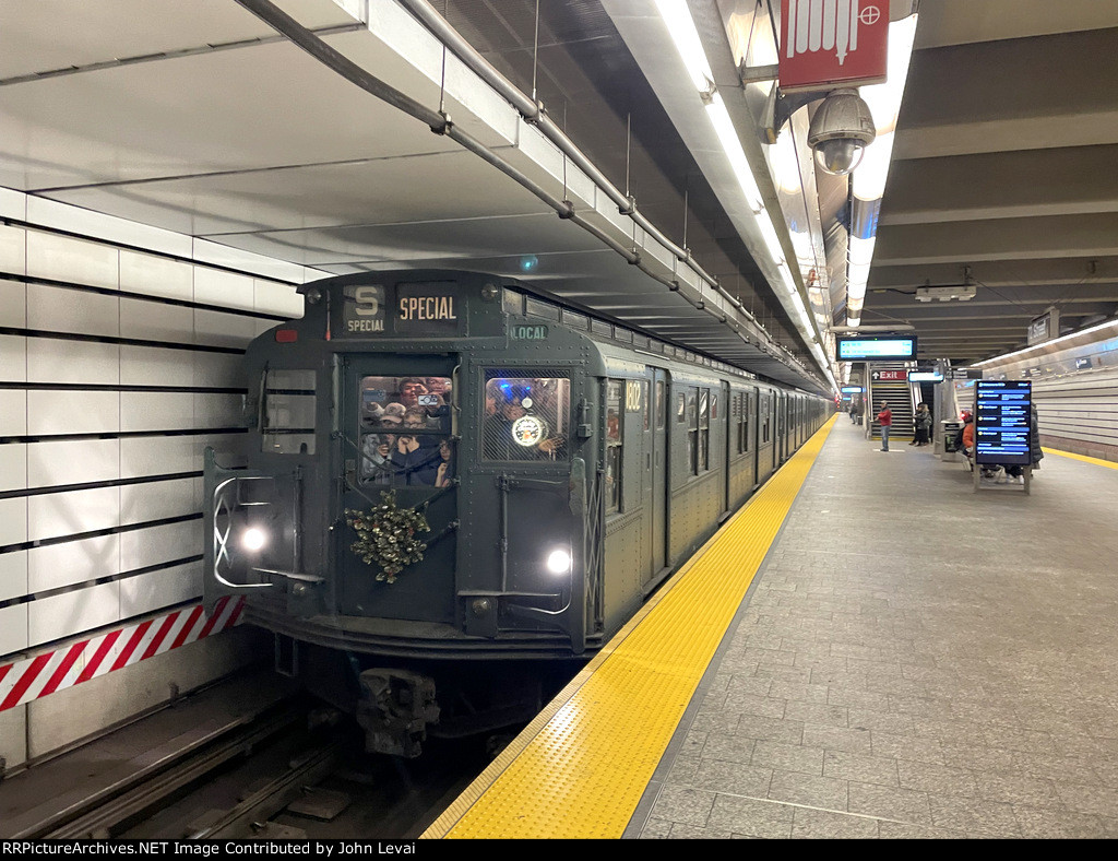 Arnine Car # 1802 leads a midday Holiday Train into 72nd Street Station on the Q Line